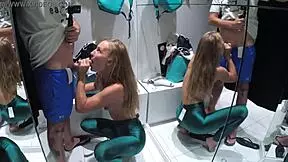 Teen girl performs blowjob to a boyfriend inside a fitting room