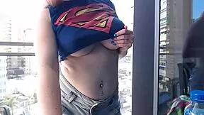 Redhead flaunts curves on balcony