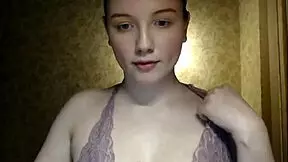 A lovely and shy girl provocatively flashes her huge natural chest