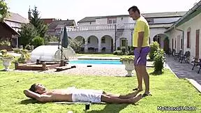 A young blonde woman has sex with an old man at the pool or rather in water on a swimming pool