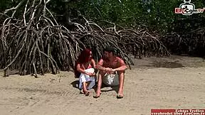 Short-haired young redheaded woman with small chest exposing her vagina has sex near the seashore