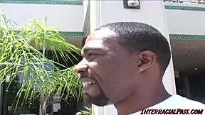 A beautiful young woman shares her attractive buxom beauty with black gentlemen in a hardcore group fuck Session