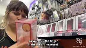 A young Asian beauty tries out sex toys at a crazy Tokyo shop