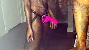 Beautiful black girls enjoy strap-on sex and nipple play