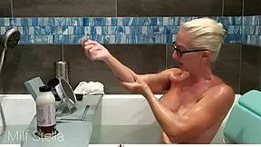 Shaved pussy and big tits in solo bathing session