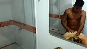 A blonde teen helps her stepson to have a hot shower and gives him a blow job