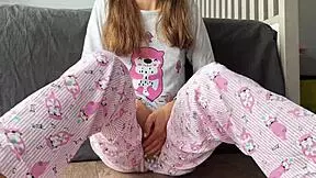 Stepsister masturbates in pink pajamas, close up