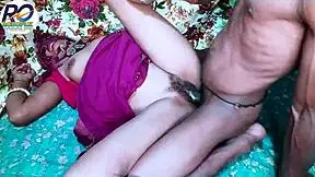 Desi bhabhi in a vibrant red saree, passionately kissed
