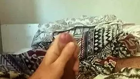 Delicious brunette masturbating laid down while wanking her pussy