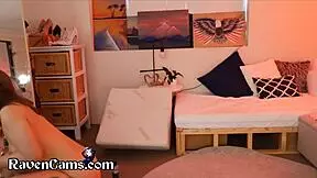 A girl is fucking a dildo in her ass for the sake of strangers