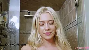 Blonde beauty model has a lot of fun while taking shower
