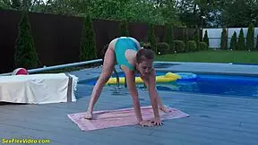 A sexy girl is stretching in an extreme pose